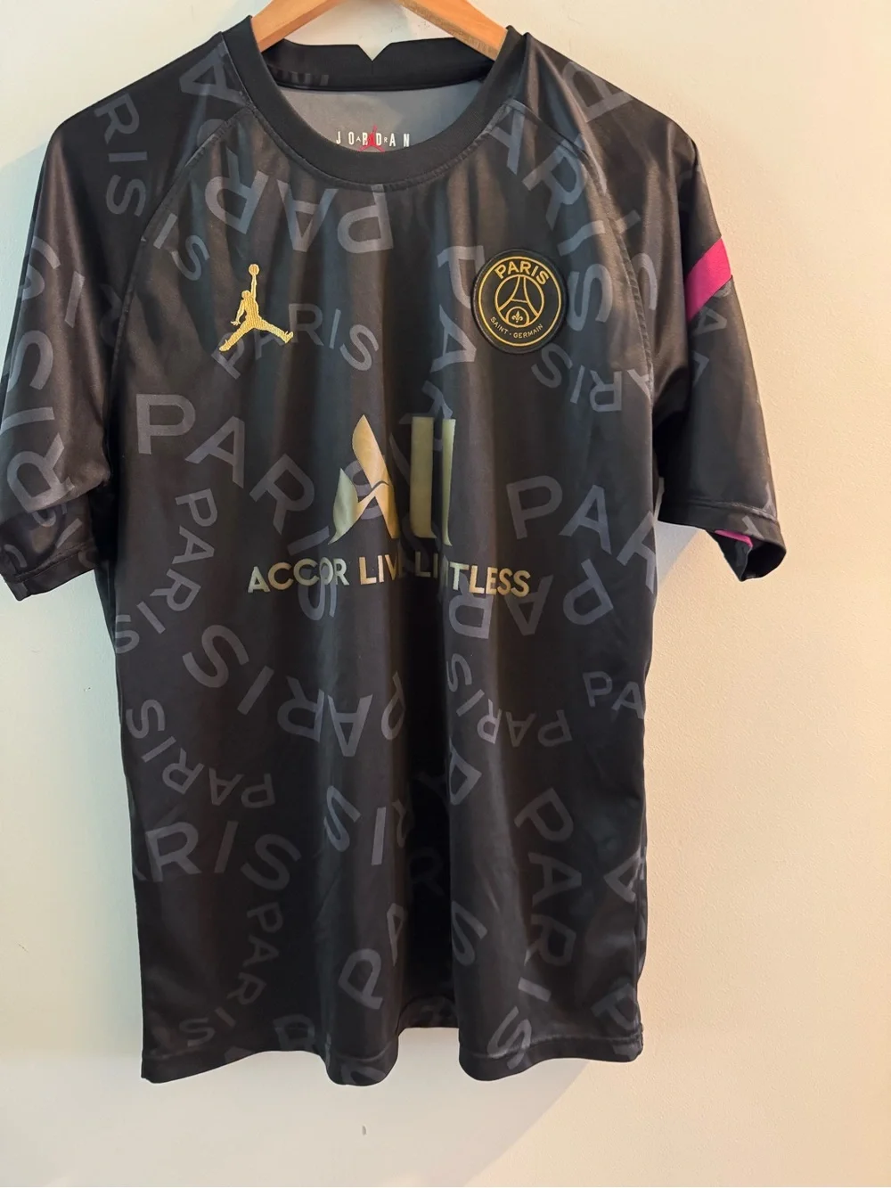 Jordan Men’s Black Jersey with Gold Logos and Pink Sleeve Detail